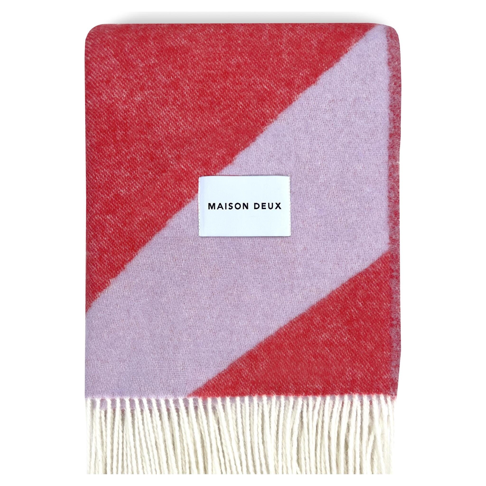 Jacquardgewebte Wolldecke in Lila und Rot aus 100 % neuseeländischer Wolle