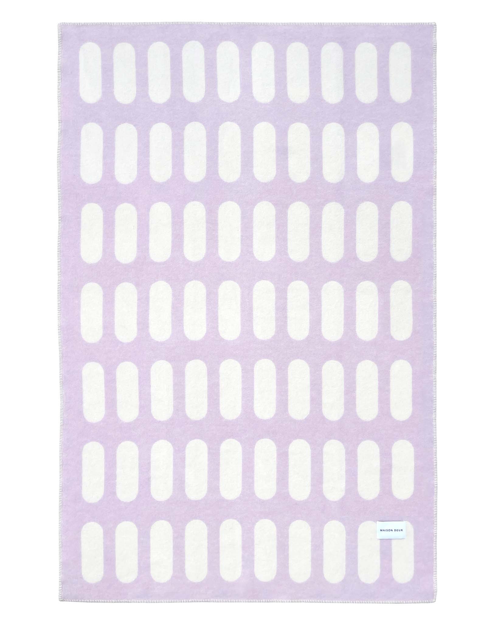 Wolldecke von Maison Deux in den Farben Lila und Weiss, Rückseite