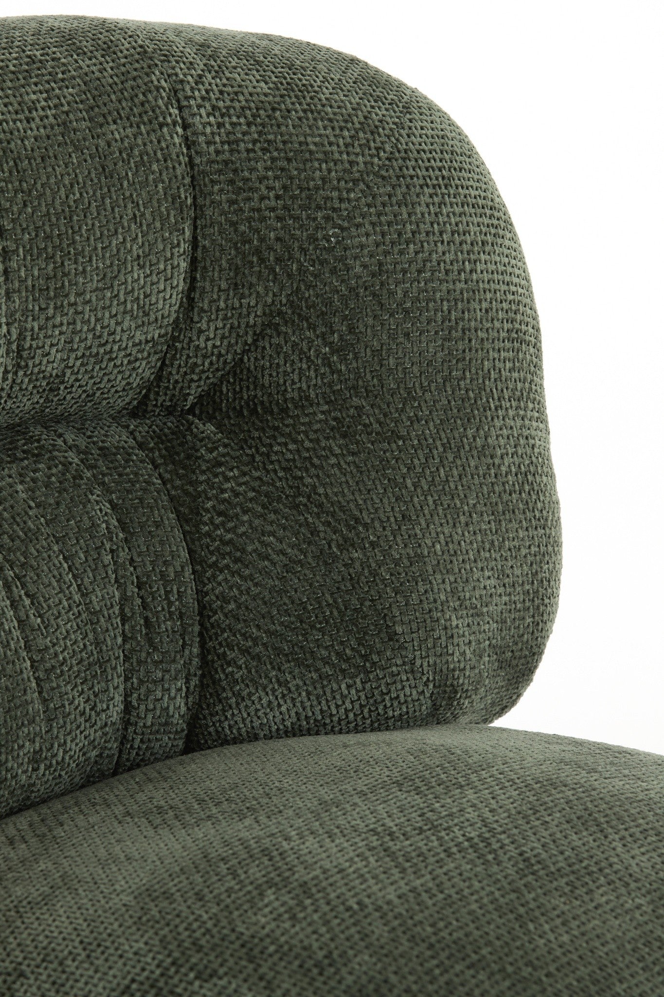 Moderner Polstersessel in Grün mit klarer Linienführung