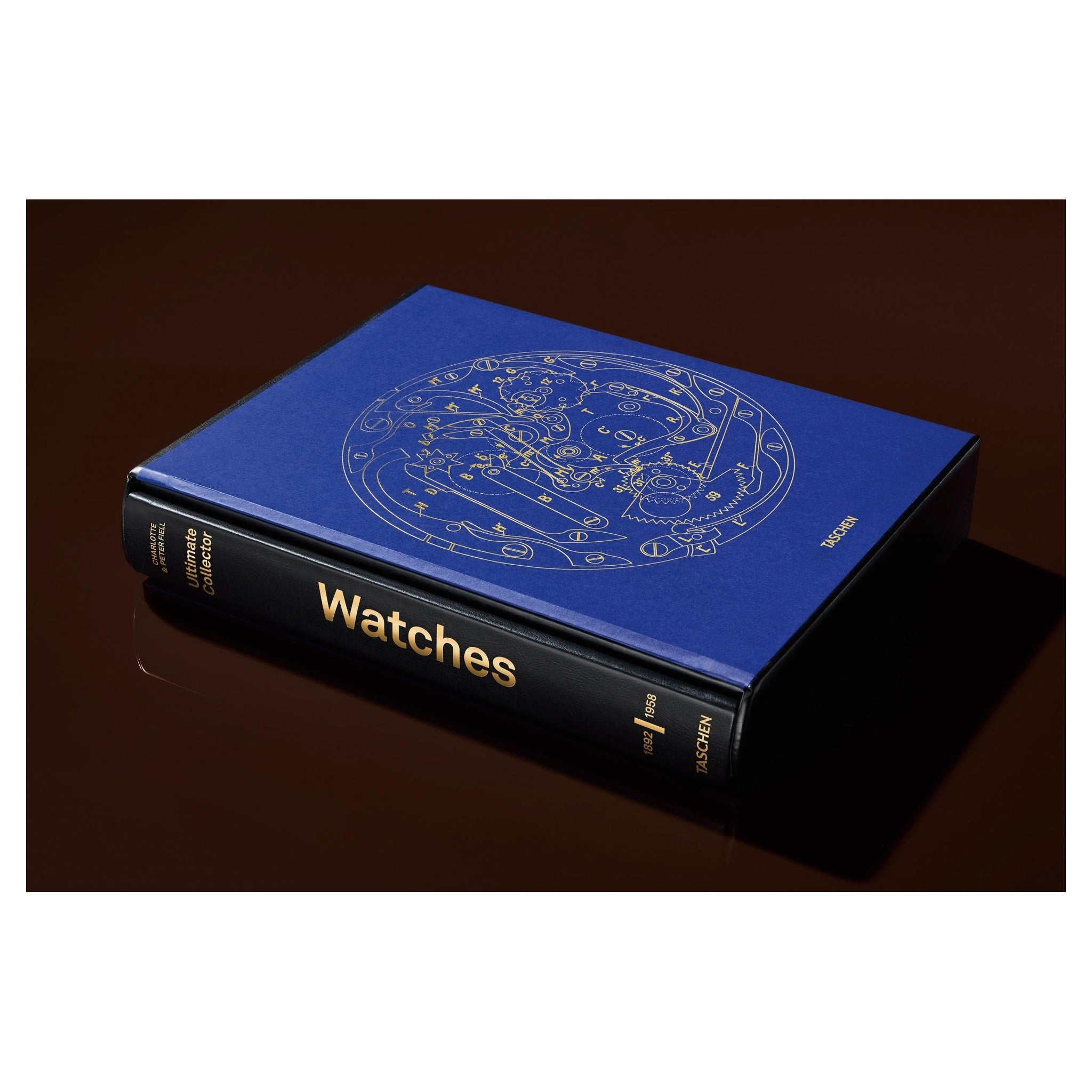 Der blaue Schuber mit präziser Uhrwerkszeichnung elegant vor dunklem Hintergrund positioniert.